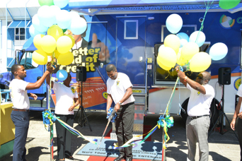 (L-R) Staff Member Christopher Bostic, Group Chief Executive Officer Clorinda Alleyne, President of the Board of Directors Raphael Holder and Br